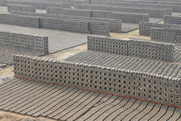 A group of cinder blocks sitting on top of a cement floor